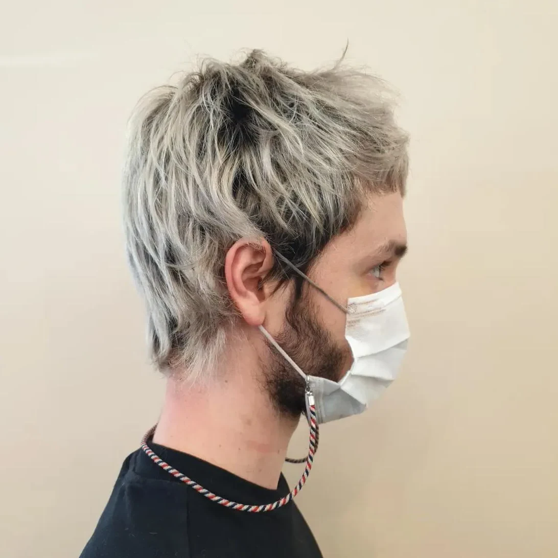 DJ I Hate Models décoloration platine mullet profil